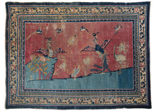 Antique Pictorial Peking area rug featuring  a pictorial scene on an icey blue foreground and a hot pink background. A variety of auspicious birds are showcased, most prominently two Fenghuang about to take flight and a crane standing on one leg. The rug has been "painted" sometime after it was woven and imported into the United States. Likely in the 1920s when this practice was all the rage. 