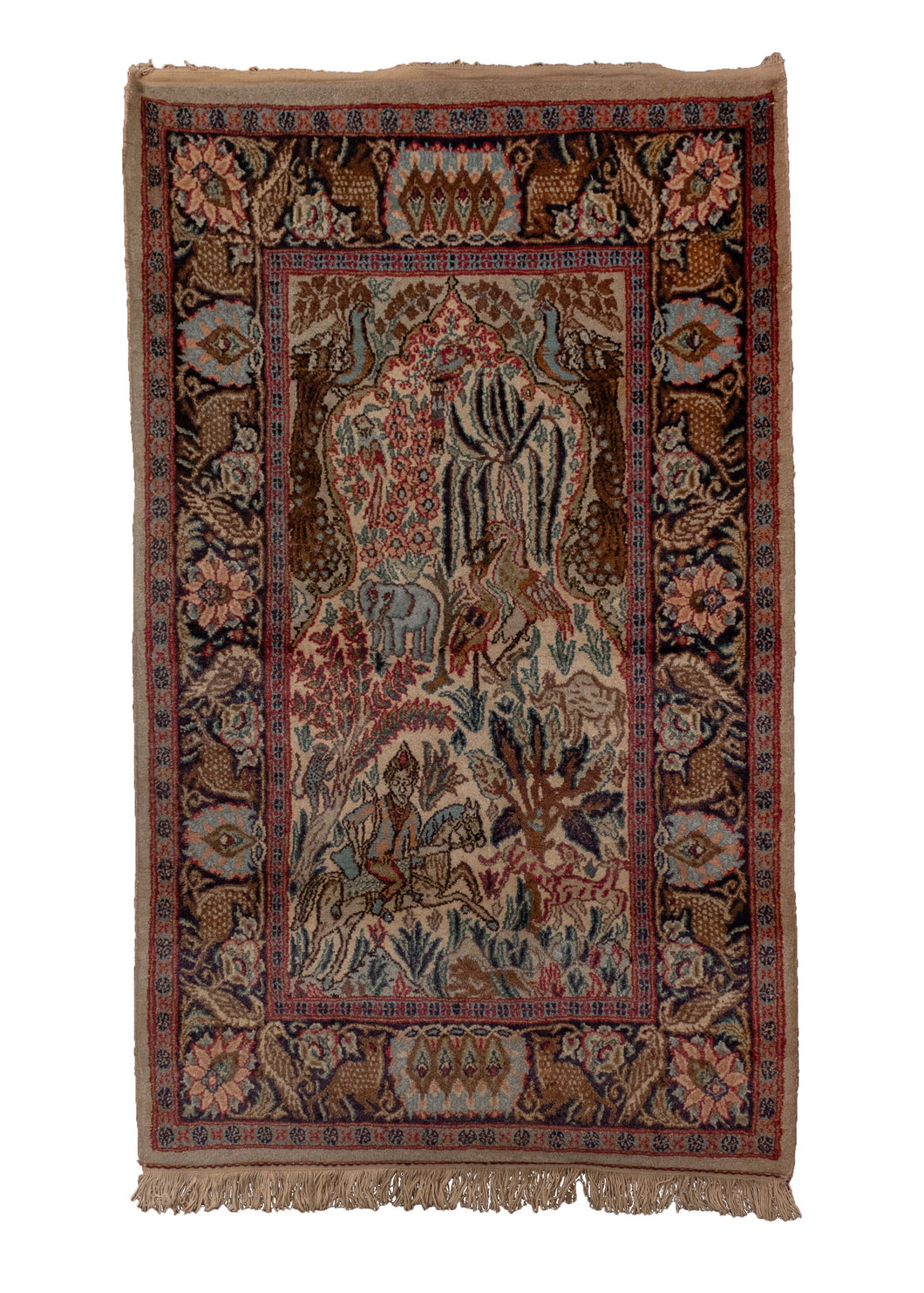 Small pictorial rug handwoven in India, featuring a variety of animals in a forest setting, and a rider on horseback. In excellent condition, signs of wear consistent with age. 