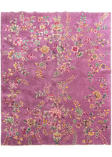 Chinese purple pink deco featurinng truly unique light purple field. The design is open and borderless, and is composed of large-scale floral motifs like sprays, vines, and tendrils growing from vases at either ends of the rug. Notice the stippling and color variation, beautifully rendered by the weaver. The accenting palette is composed of greens, pinks, and golden yellows. 