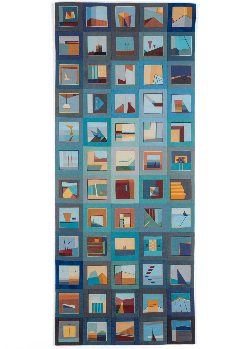 Erin Wilson Quilt entitled Color Story: Blue with Torquoise featuring beautiful palette of orange, red, yellow, and turquoise atop a wide range of blues in the background. This elongated quilt is separated into squares, five wide and twelve long. Each square represents a different scene, patchwork pieced together intricately with cotton that has been hand dyed. In each square you can find a different interpretation of the artist's surroundings, beautifully sewn. 