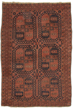 This Ersari Turkmen Rug features a traditional Ersari gül design on a soft brick ground, with oranges, and navy small ivory accents completing the color palette. The guls progressively stretch from rounder to more oval from top to bottom. In a hard-to-find and highly desirable mid-size.