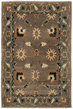 This Vintage Tibetan Tufekian features an open field of various palmettes on a spacious grid framed by a border of scrolling palmettes on a similar scale. The whole composition is rendered in a simple yet uncommon palette of black, ivory, copper, gray, and brown.