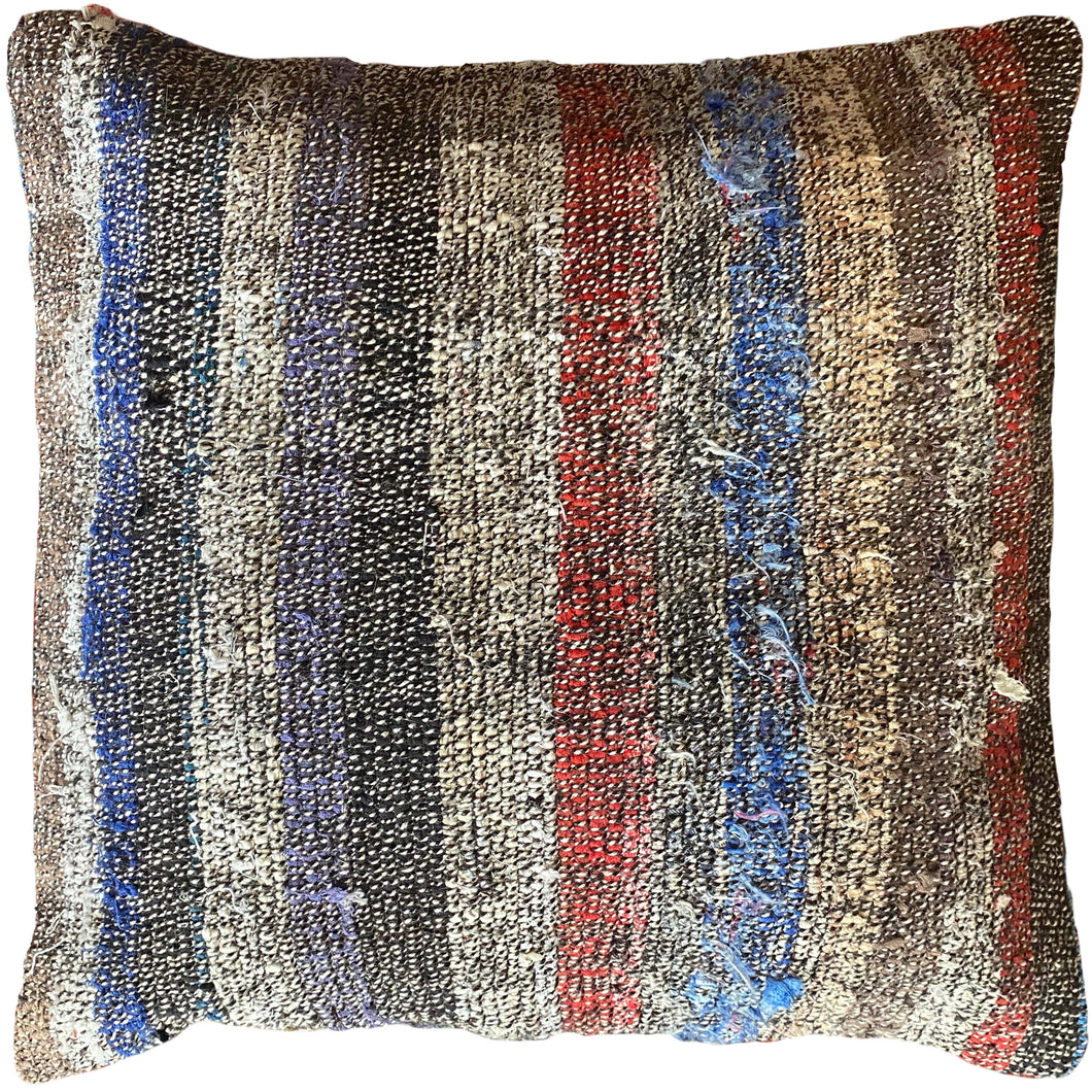 Pillow crafted from fragments of a flatwoven Turkish cicim made of goat hair and cotton.