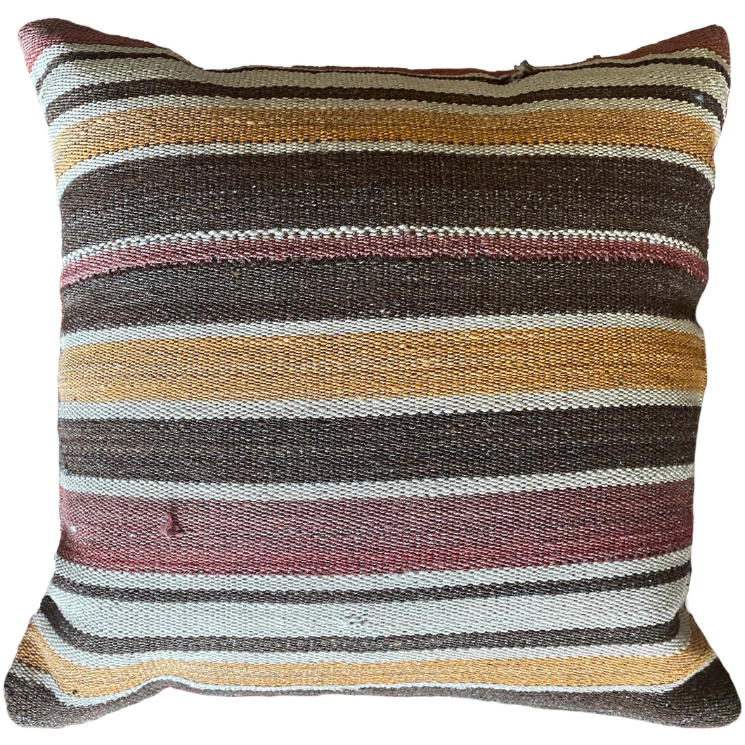 Pillow crafted from fragments of a Turkish wool kilim.