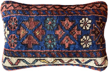 Pillow crafted from fragments of handwoven antique Kurdish rug 