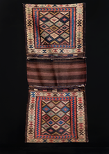 Double saddlebag or "Khorjin" was handwoven by Kurds during second quarter of 20th century. Closure is composed of brown, red and white slit tapestry with blue and purple braided loops. Classic Jaff patterning of multicolored diamonds. 