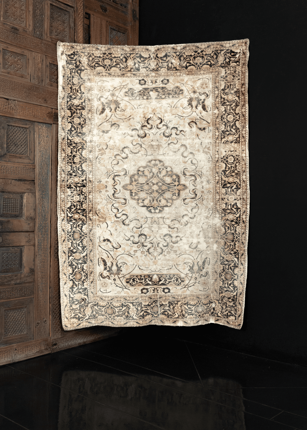 Image of silk Keyseri rug featuring delicate floral pattern on white field with subtle brownish green filigree.