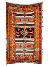 Mid Century Moroccan Ouaouz Area Rug with bright orange and red shaggy pile, as well as neutral toned sumac weave