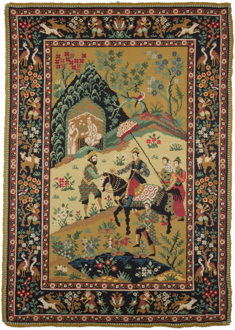 Porteugese needlepoint featuring a scene more commonly associated with the Mughal or Safavid traditions. It appears to be an exchange between a Portuguese noble and his entourage with a bearded man wearing a turban. The border features a variety of hunting scenes.