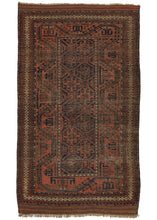 This Orange and Blue Baluch Rug features a thin field of latch hooked devices on a lattice grid only two columns wide.  A thick Turkmen line border that slithers around the perimeter and is further framed by a thin ivory scroll border composed of what may be an abstracted dragon motif. It utilizes a limited palette of orange, blue, brown, and ivory throughout. The play of scale and rhythmic use of negative space create an effective rendition with lots of movement for such a restrictive palette.