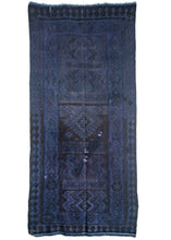 vintage Turkish kilim overdyed featuring a deep purple field. The underlying geometric pattern is still visible with hints of abrash distinguishable.