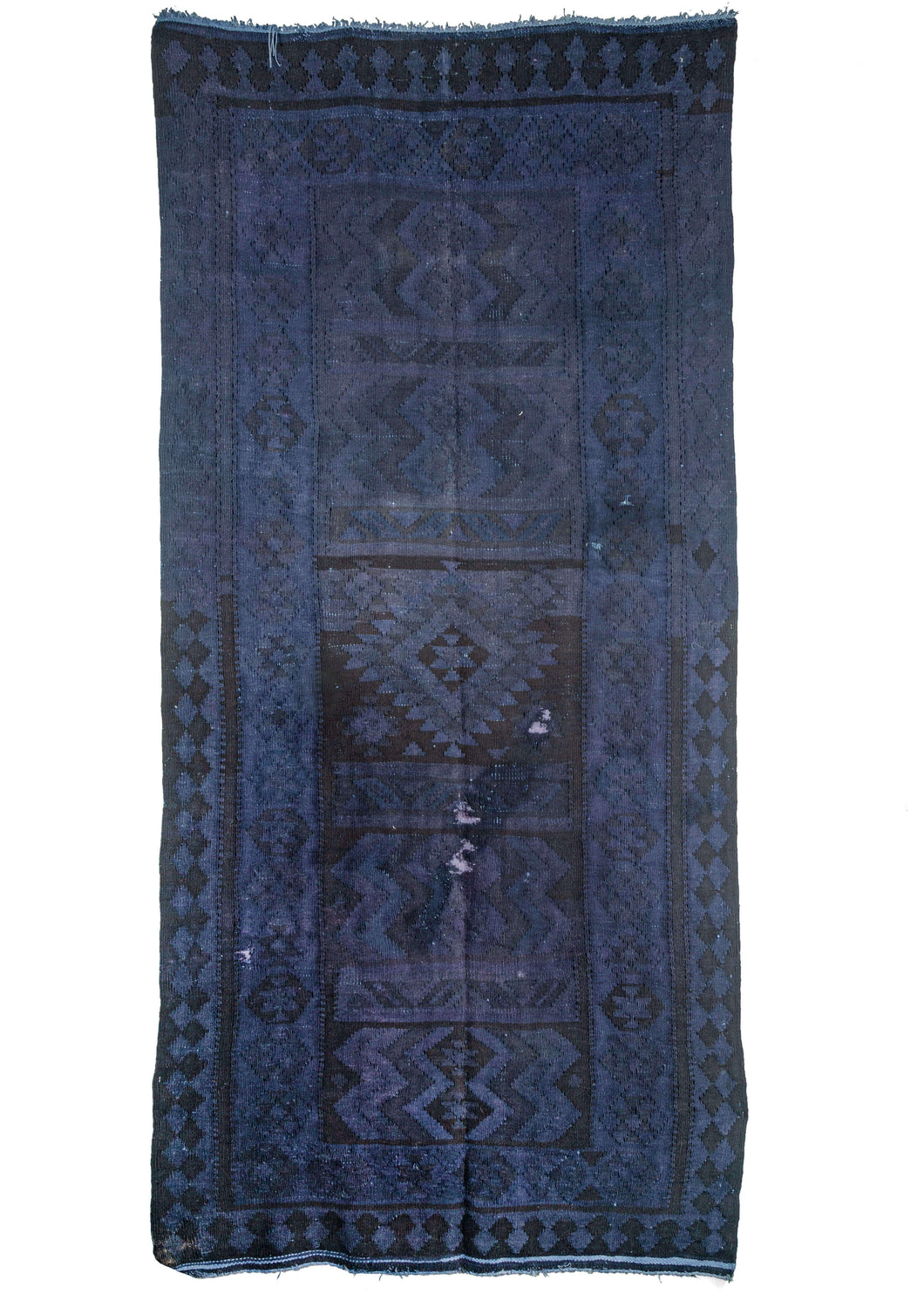 vintage Turkish kilim overdyed featuring a deep purple field. The underlying geometric pattern is still visible with hints of abrash distinguishable.