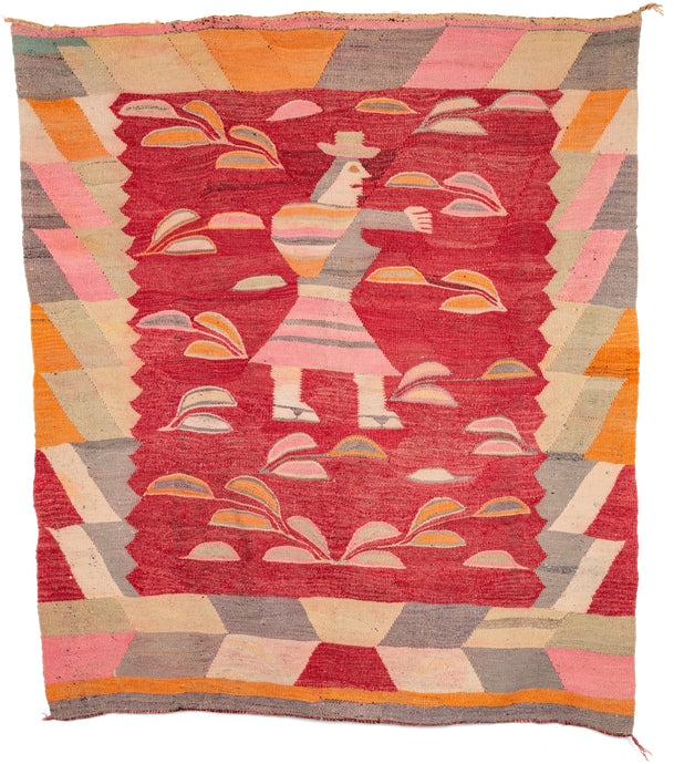 Vintage Bolivian pictorial tapestry weaving depicting a female farmer harvesting what is likely coca leaves. She wears a striped dress, sandals, a striped bag, and a hat which many indigenous people wear. It is rendered on strong red ground with pinks, oranges, beige, and a purply gray and framed by a wide border composed of large blocks of color.