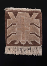 Handwoven vintage Tibetan prayer mat.   This soft and furry rug features a simple design of a central cross on a geometric shape, all woven in a gradient of taupe browns.  In excellent condition, signs of wear consistent with age. High pile, with a soft handle. Original fringe still intact. 