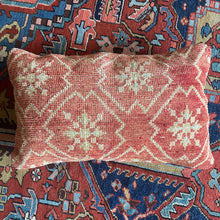 Pillow crafted from fragments of handwoven antique Oushak rug from Turkey.