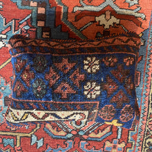 Pillow crafted from fragments of handwoven antique Kurdish rug from Northwest Iran.