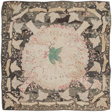 This Antique Square Hooked Rug features a circular medallion with a central flying bird carrying a twig with berries in its mouth. Along the perimeter of the medallion are roses and four vases filled with flowers at a 45-degree angle. The whole is framed by a border of sticks each with a large leaf growing from its center. Thinly rendered vine work filled much of the rest of the open spaces betwen the pattering.